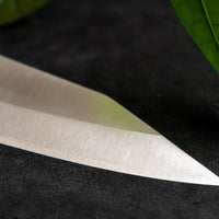 Kurosaki Gyuto from the Gekko line is made by master blacksmith Yu Kurosaki. The minimalistic, lightweight, perfectly balanced blade is treated to a high polish − hence the name Gekkō (月光) which means moonlight in Japanese. VG-XEOS steel (61 HRC), which has excellent resistance to wear and corrosion.