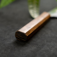 Kurosaki Gyuto from the Gekko line is made by master blacksmith Yu Kurosaki. The minimalistic, lightweight, perfectly balanced blade is treated to a high polish − hence the name Gekkō (月光) which means moonlight in Japanese. VG-XEOS steel (61 HRC), which has excellent resistance to wear and corrosion.