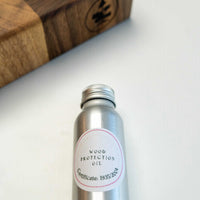 end grain walnut cutting board, handmade in Slovenia. Pictured: Included mineral wood protection oil.