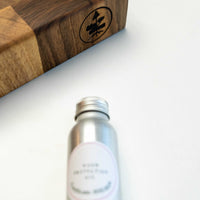 end grain walnut cutting board, handmade in Slovenia. Pictured: Included mineral wood protection oil and edge of board.