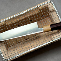 This Harukaze 210mm (8.3") Gyuto’s blade, at just 2mm (0.08"), is among the thinnest we have in our range. The knife has an immaculate "out of the box" sharpness, laser-thin spine of the blade, good balance and offers a lightweight feeling while in use. VG-1 steel is synonymous with efficiency and durability and is extremely easy to maintain as the blade is completely stainless. Unlike other knives, this knife is not laminated and is made entirely of one steel, being of so-called "monosteel" construction.