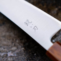 Hokiyama Gyuto SRS13 Migaki 210mm (8.3") is a knife suitable for professional users and home cooks who like low-maintenance knives that offer excellent cutting performance and edge retention, while still being fairly easy to resharpen. Fitted with a unique traditional Japanese handle from oak wood.
