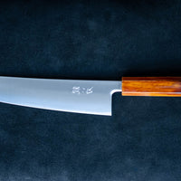 Hokiyama Gyuto SRS13 Migaki 210mm (8.3") is a knife suitable for professional users and home cooks who like low-maintenance knives that offer excellent cutting performance and edge retention, while still being fairly easy to resharpen. Fitted with a unique traditional Japanese handle from oak wood.