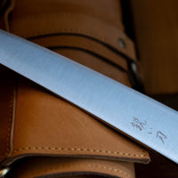 Hokiyama Gyuto SRS13 Migaki 210mm (8.3") is a knife suitable for professional users and home cooks who like low-maintenance knives that offer excellent cutting performance and edge retention, while still being fairly easy to resharpen. Fitted with a unique traditional Japanese handle from oak wood.