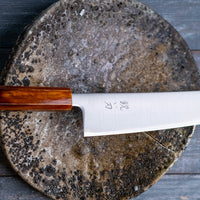 Hokiyama Gyuto SRS13 Migaki 210mm (8.3") is a knife suitable for professional users and home cooks who like low-maintenance knives that offer excellent cutting performance and edge retention, while still being fairly easy to resharpen. Fitted with a unique traditional Japanese handle from oak wood.