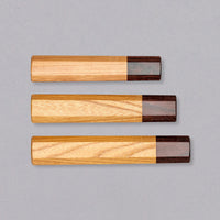 A traditional Japanese handle of octagonal shape, made of mahogany and zelkova wood. The handle has a natural wooden feel and its minimalistic, traditional look will give any blade an added dimension of elegance without drawing too much attention from the blade.