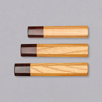 A traditional Japanese handle of octagonal shape, made of mahogany and zelkova wood. The handle has a natural wooden feel and its minimalistic, traditional look will give any blade an added dimension of elegance without drawing too much attention from the blade.