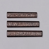 A traditional Japanese handle of octagonal shape, made of oak wood. Without a ferrule, this handle is anything but minimalistic. Featuring a unique, glossy pattern of wavy and twisting lines, it will give any blade an added dimension of elegance and luxury, as well as an improved grip due to its unique texture.