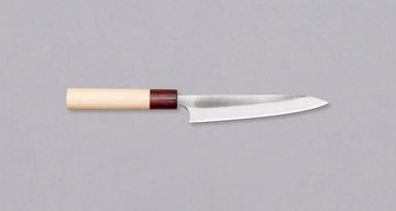 The striking new collection by the brand Masakage and blacksmith Yoshimi Kato is called Yuki - snow. The subtle whiteness of the blade and the light magnolia handle are designed to remind one of a snowy winter landscape. With a carbon steel core and stainless outer layers, this line represents the perfect blend of beauty and performance.