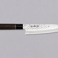Kawamura Santoku Damascus is a multi-purpose Japanese kitchen knife. The core is made out of stainless AUS-10 steel, wrapped in layers of Damascus steel and the top part of the blade is adorned with hammer prints. The traditional Japanese handle is made out of burnt chestnut wood with a buffalo horn ferrule.