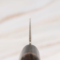 Kawamura Santoku Damascus is a multi-purpose Japanese kitchen knife. The core is made out of stainless AUS-10 steel, wrapped in layers of Damascus steel and the top part of the blade is adorned with hammer prints. The traditional Japanese handle is made out of burnt chestnut wood with a buffalo horn ferrule.