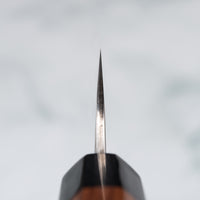 Knife choil. Kurosaki Sujihiki Fujin is the work of the talented blacksmith Yu Kurosaki. The lightweight, perfectly balanced blade has a unique tsuchime and damascus finish. The knife is made of VG-10 stainless steel (60-61 HRC), which has excellent resistance to wear and corrosion, and is fitted with a rosewood octagonal handle.