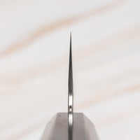 Choil of the knife. Nigara Kiritsuke Gyuto VG-10 Damascus Tsuchime 210mm (8.2") is a multi-purpose Japanese kitchen knife, suitable for preparing meat, fish, and vegetables. VG-10 stainless steel ensures a fine sharpness with little to no maintenance. As such, the knife is also suitable as a first Japanese knife or gift. Fitted with an ebony handle.