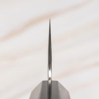 Knife choil. Nigara Kiritsuke Gyuto VG-10 Damascus Tsuchime 240mm (9.4") is a multi-purpose Japanese kitchen knife, suitable for preparing meat, fish, and vegetables. VG-10 stainless steel ensures a fine sharpness with little to no maintenance. As such, the knife is also suitable as a first Japanese knife or gift. Fitted with an ebony handle.