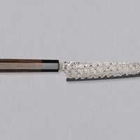 Nigara Kiritsuke Petty SG2 Damascus 150mm is a Japanese kitchen knife suitable for smaller cutting tasks. It's adorned with a raindrop damascus pattern and fitted with a wenge wood handle. Its SG2 powder steel core ensures long-lasting sharpness with little to no maintenance, as the steel resists corrosion very well.