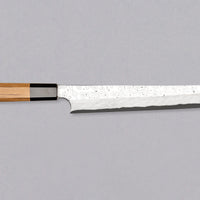 Nigara Kurozome Kiritsuke Yanagiba Aogami #2 Damascus 240mm (9.4") is a traditional single-bevel Japanese knife used for preparing meat and raw fish, especially sashimi and nigiri sushi, and meat. Its length allows the user to slice different types of protein in one single pulling motion, that will – together with the razor-sharp single bevel blade – birth smooth, shiny cuts.