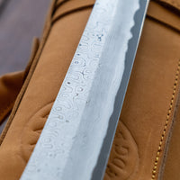 Nigara Kurozome Sakimaru Yanagiba Aogami #2 Damascus 270mm (10.6") is a traditional single-bevel Japanese knife used for preparing meat and raw fish, especially sashimi and nigiri sushi, and meat. Its length allows the user to slice different types of protein in one single pulling motion.