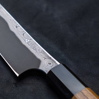 Nigara Kurozome Sakimaru Yanagiba Aogami #2 Damascus 270mm (10.6") is a traditional single-bevel Japanese knife used for preparing meat and raw fish, especially sashimi and nigiri sushi, and meat. Its length allows the user to slice different types of protein in one single pulling motion.