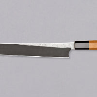 Nigara Kurozome Sakimaru Yanagiba Aogami #2 Damascus 270mm (10.6") is a traditional single-bevel Japanese knife used for preparing meat and raw fish, especially sashimi and nigiri sushi, and meat. Its length allows the user to slice different types of protein in one single pulling motion.