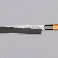 The quality and craftsmanship of this Nigara Kurozome Yanagiba Aogami #2 Damascus 270mm (10.6") is simply superb - from the beautifully polished choil to the unique damascus pattern that surrounds the spine of the blade and extends to its back. The outer layers of the blade have a pearl mosaic-like appearance, which you won't find often even in the most high-end blades.