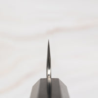 Choil of the knife. Nigara Petty VG-10 Damascus Tsuchime 150mm (5.9") is a small multi-purpose Japanese kitchen knife, suitable for in-hand and smaller cutting tasks. VG-10 stainless steel ensures a sharpness with little to no maintenance. As such, the knife is also suitable as a first Japanese knife or gift. Fitted with an ebony handle.