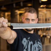 One of the most impressive collector's pieces we have on offer. This spectacular sakimaru yanagiba by the famous Nigara Hamono smithy is a fusion of excellent performance and outstanding aesthetics rarely matched in the world of knives. Core from Aogami #2 steel, twisted damascus lamination, fitted with ebony handle.