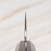 Nigara Santoku AS Migaki Tsuchime is a multi-purpose Japanese kitchen knife, suitable for preparing meat, fish and vegetables. Due to its easy-to-resharpen Aogami Super steel core (63 HRC) it keeps sharp for a long time. The beautiful combination of tsuchime, migaki and kasumi finishes makes this blade functional art.