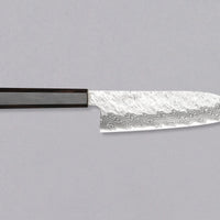 Nigara Santoku VG-10 Damascus Tsuchime is a multi-purpose Japanese kitchen knife, suitable for preparing meat, fish, and vegetables. Its VG-10 stainless steel core ensures a fine sharpness with little to no maintenance. As such, the knife is also suitable as a first Japanese knife or gift. Fitted with ebony handle.