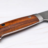 Japanese knife handle - western type. Saji Gyuto SRS13 Tsuchime 240mm (9.4") is a multi-purpose Japanese kitchen knife, suitable for preparing meat, fish, and vegetables. It’s a truly out-of-this-world piece of knifemaking. Its heart was forged out of SRS13, a high-speed powder steel, renowned for its high hardness and excellent corrosion resistance.