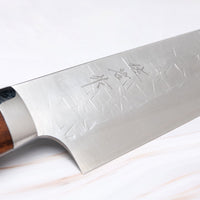 Saji Gyuto SRS13 Tsuchime 240mm (9.4") is a multi-purpose Japanese kitchen knife, suitable for preparing meat, fish, and vegetables. It’s a truly out-of-this-world piece of knifemaking. Its heart was forged out of SRS13, a high-speed powder steel, renowned for its high hardness and excellent corrosion resistance.