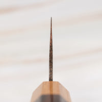 The Saji Gyuto VG-10 Gold RWO 240mm is a high-quality, multi-purpose Japanese knife crafted by Takeshi Saji of Takefu Knife Village. It has a special lamination process where brass is added to the outer layers to achieve a gold-colored damascus pattern. It's made from stainless VG-10 steel and has a rosewood wa handle.