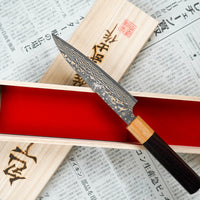 The Saji Petty VG-10 Gold RWO 135 mm is a small Japanese kitchen knife suitable for preparing meat, fish and vegetables. However, it would be an injustice to call it just a kitchen knife, as it is a remarkable example of blacksmith's craftsmanship - from its unique design to its very specific features.
