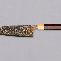 Saji Santoku VG-10 Gold RWO 165mm is a versatile Japanese kitchen knife suitable for preparing meat, fish and vegetables. However, it would be an injustice to call it just a kitchen knife, as it is a remarkable example of blacksmith's craftsmanship - from its unique design to its very specific features.