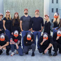 SharpEdge team wearing the exclusive SharpEdge x Vincent Trinidad Trucker Hat