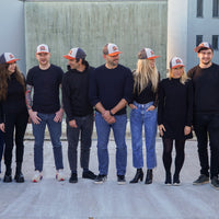 SharpEdge team wearing the exclusive SharpEdge x Vincent Trinidad Trucker Hat