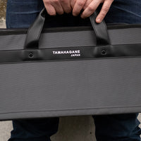 Tamahagane Chef's Knife Bag / holds 7 knives ; The Tamahagane knife bag is an excellent choice for professionals and home-cooking enthusiasts who want to have their knives ready in no time whenever occasion requires. The bag contains 7 separate pockets for kitchen knives and other cooking utensils.