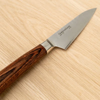 Tamahagane Paring knife is mostly used for in-hand cutting for peeling, paring and decorating, trimming meat, coring apples, cutting out potato eyes and similar tasks. A matte blade finish, featured with the core VG-5 steel hardened to 61 HRC.