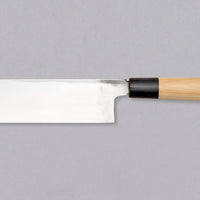 Kakugata Usuba is forged from Shirogami #1, one of the purest and most traditional steels used in Japanese knife manufacturing. Fitted with a Japanese handle made of magnolia wood topped with a buffalo horn ferrule, this minimalistic knife showcases the qualities of traditional Japanese blades we like most.