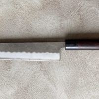 Hokiyama Kiritsuke Ginsanko 210mm (8.3")_4 Hokiyama Kiritsuke Ginsanko 210mm (8.3") is a multi-purpose Japanese kitchen knife. The Kiritsuke blade shape is a multifunctional Japanese kitchen knife, suitable for everyday use and the 210mm (8.3") blade length is an optimal size for chopping vegetables as well as cutting larger pieces of meat and fish. 63 HRC!