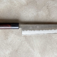 Hokiyama Kiritsuke Ginsanko 210mm (8.3")_5 Hokiyama Kiritsuke Ginsanko 210mm (8.3") is a multi-purpose Japanese kitchen knife. The Kiritsuke blade shape is a multifunctional Japanese kitchen knife, suitable for everyday use and the 210mm (8.3") blade length is an optimal size for chopping vegetables as well as cutting larger pieces of meat and fish. 63 HRC!