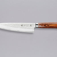 Tamahagane "TSUBAME" Gyuto 210mm (8.3")_1Tamahagane Gyuto is an all-rounder when it comes to knives, designed for a wide range of kitchen tasks. It will excel at chopping vegetables and slicing larger cuts of meat. The narrow tip can be used for tasks where precision is key. A true workhorse, that will ease long hours of food prep in a professional kitchen. The core of the blade has a high-polish finish and is forged out of VG-5 (High Carbon Molybdenum Vanadium Steel) steel hardened to 61 HRC.