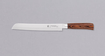 Tamahagane "SAN" Pankiri (Bread Knife) 230mm (9.1") bread knife is an indispensable tool for professional chefs and home cooks. It saws through soft bread without much pressure and glides effortlessly through hard crusts. Suitable for slicing a roast or any large piece of meat, as well as cakes, sushi, tomatoes etc.