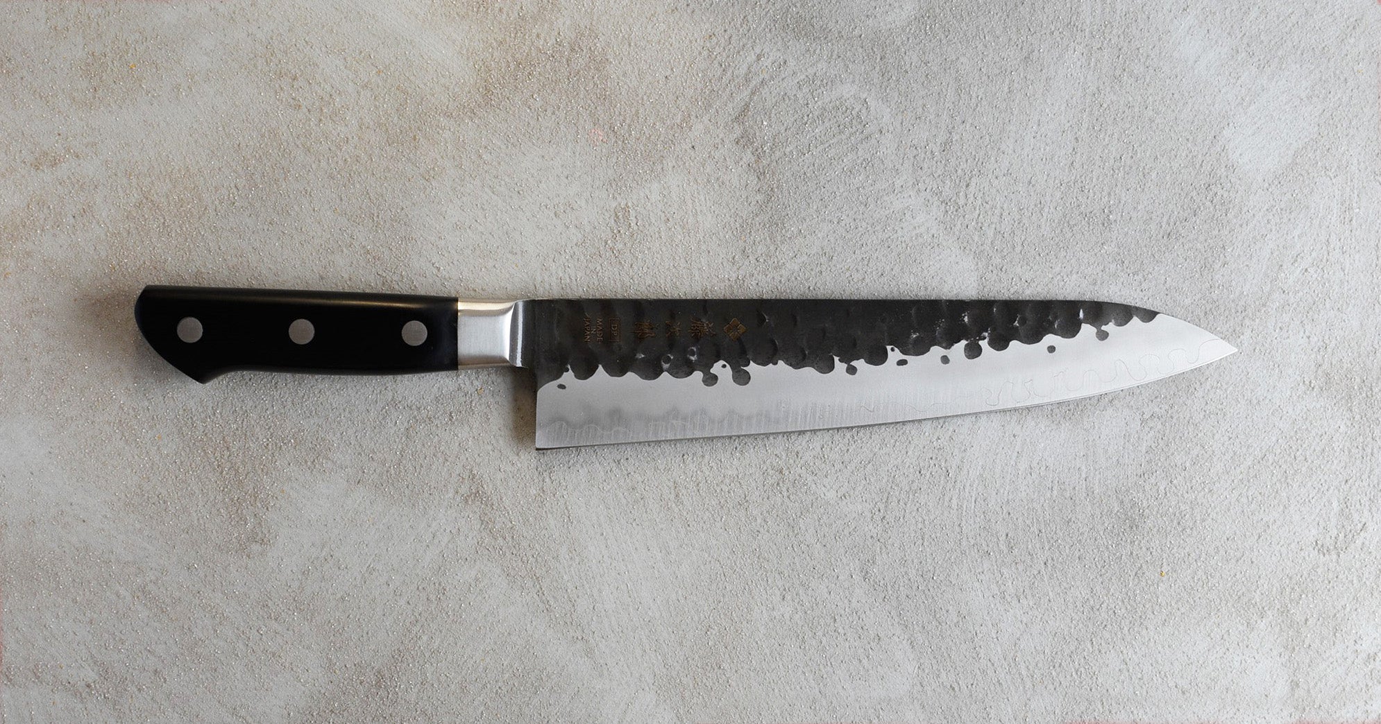 http://sharpedgeshop.com/cdn/shop/products/TojiroVg10Gyuto240mmHammeredOsterRob.jpg?v=1585079513