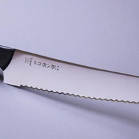 Micarta Pankiri (Bread Knife) 270mm (10.6")_2 A hand-forged Tojiro Micarta 270mm (10.6") bread knife with a compact black woods handle and a long blade (270 mm) is an indispensable tool for either professional chefs or passionate home cooks (sourdough enthusiasts, raise your hands!). The blade is made from Molybdenum Vanadium steel with 57–59 HRC.