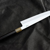 Kawamura Mizu-Honyaki Gyuto is a hand-forged masterpiece. Crafted with incredible precision, it is not simply a Japanese knife but a piece of art. On one side it is adorned with Mt Fuji and a full moon, which is replaced with a crescent on the other. A stunning collector's item, this Shirogami #2 steel honyaki blade with a rainbow sheen is forged from a single piece of high-carbon Yasuki Shirogami (White Steel) #2.