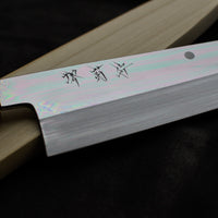 Kawamura Mizu-Honyaki Gyuto is a hand-forged masterpiece. Crafted with incredible precision, it is not simply a Japanese knife but a piece of art. On one side it is adorned with Mt Fuji and a full moon, which is replaced with a crescent on the other. A stunning collector's item, this Shirogami #2 steel honyaki blade with a rainbow sheen is forged from a single piece of high-carbon Yasuki Shirogami (White Steel) #2.