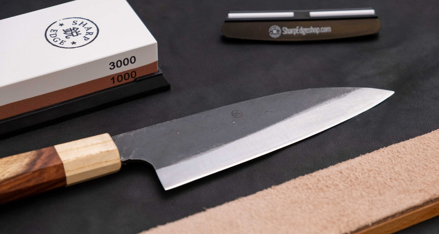 The Neverending Sharpness Bundle I [rosewood] has everything you need to get started on your Japanese knife-owning, sharpen-it-yourself journey: A basic sharpening set with a whetstone of two grits [#1000/3000] and a knife that is easy to sharpen and keep sharp long-term.