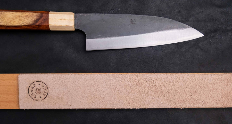 The Neverending Sharpness Bundle I [rosewood] has everything you need to get started on your Japanese knife-owning, sharpen-it-yourself journey: A basic sharpening set with a whetstone of two grits [#1000/3000] and a knife that is easy to sharpen and keep sharp long-term.