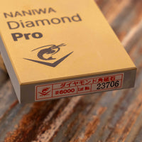 Naniwa Diamond Pro stone with grit #6000 is an extra fine splash-and-go diamond plate that is excellent for knife sharpening. Whereas many diamond stones have a single thin layer, the Naniwa Diamond Pro stones have a layer 1mm thick. This allows the stone to effectively "shed" worn layers, offering a fresh grit layer.