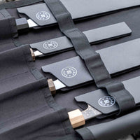 Our SharpEdge Black Chef's Knife Roll is best suited for chefs on-the-go and home cooks who need a small knife roll that can still hold very long knives (up to 440mm (17.3")). It has 4 pockets for knives and utensils, and additional velcro fasteners to keep them in place. A minimalistic, durable black knife bag.